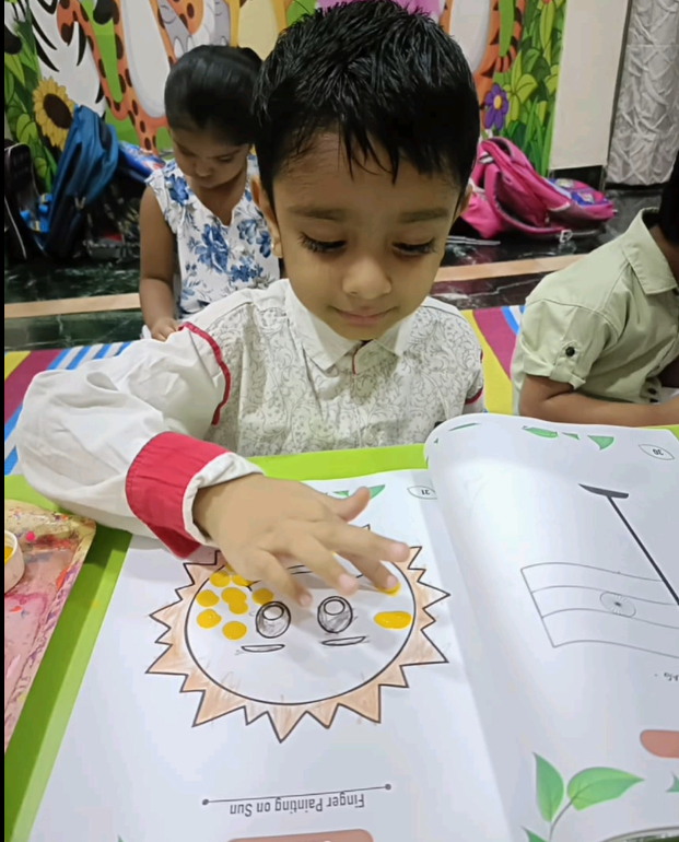 Kids engaged in creative finger painting activity at Pavilion Pre-Primary School